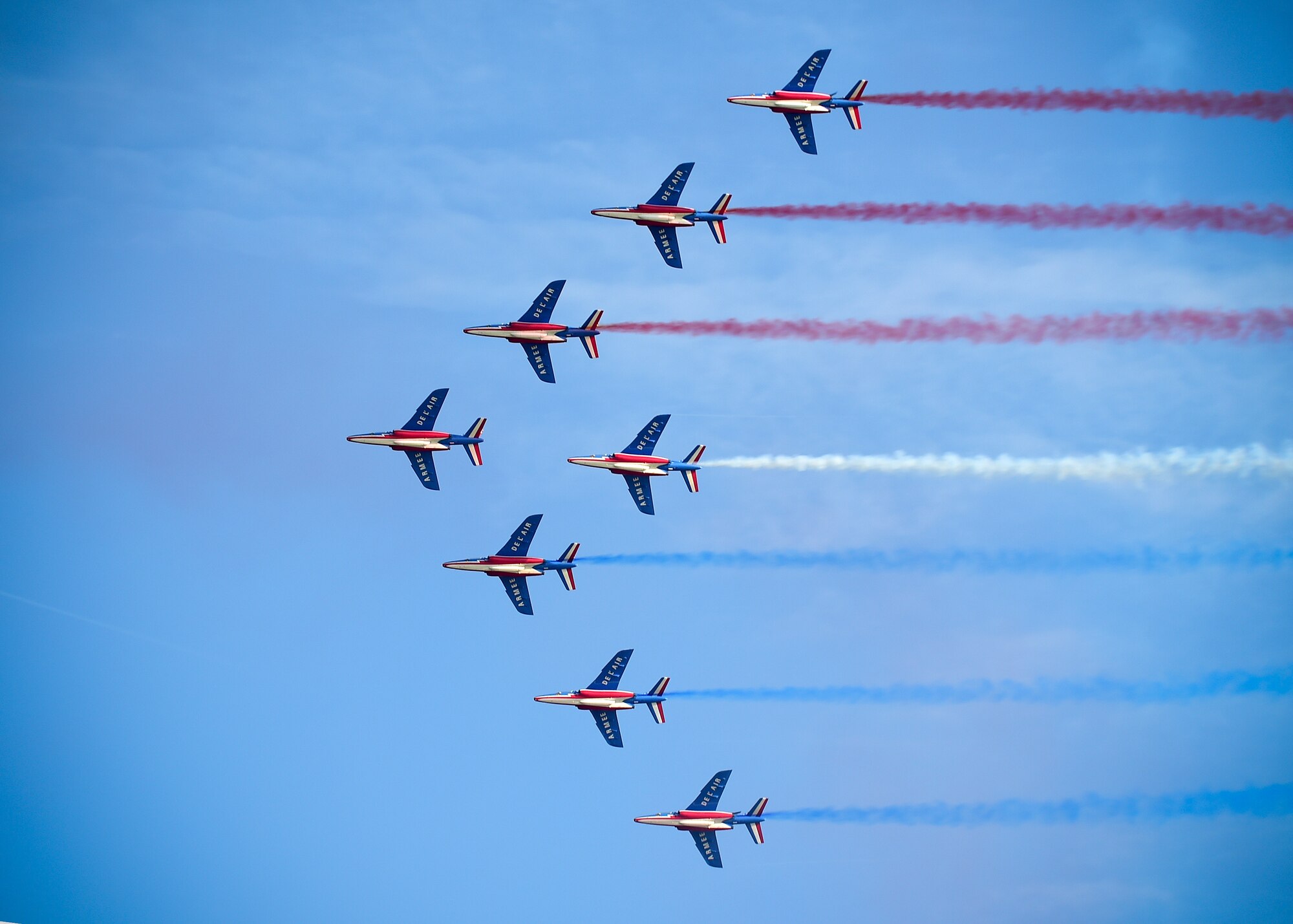The Patrouille de France, the French air force’s aerial demonstration team, performs during an ATLANTIC TRIDENT 17 World War I Remembrance Day at Joint Base Langley-Eustis, Va., April 21, 2017. With an eight-aircraft formation, the Patrouille de France is the largest aerial demonstration team in the world. (U.S. Air Force photo/Staff Sgt. Areca T. Bell)