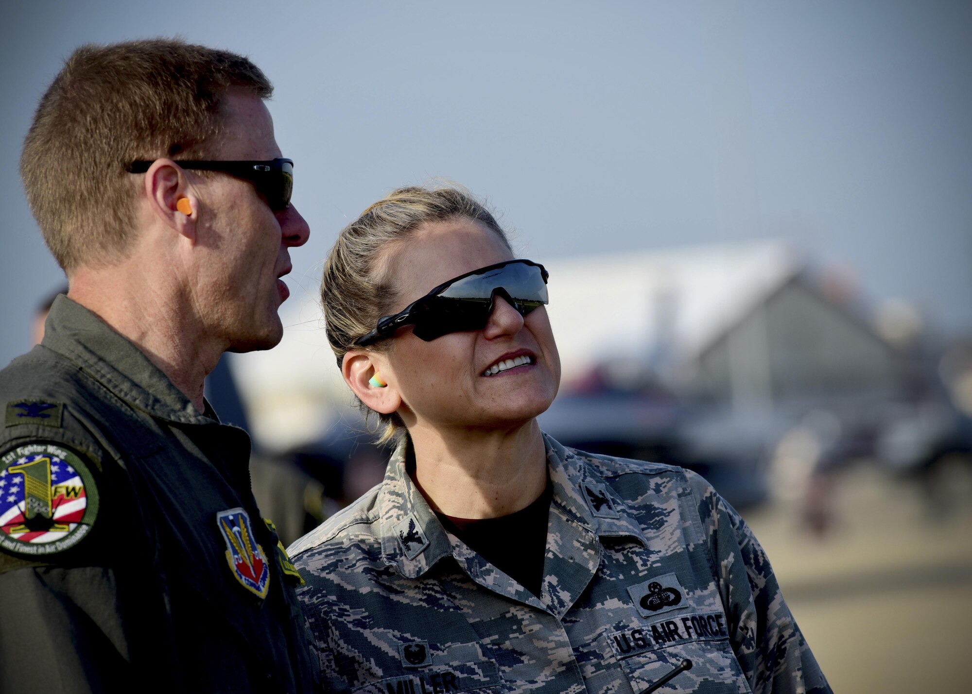 (From left) U.S. Air Force Cols. Donald Borchelt, 1st Fighter Wing vice commander, and Caroline Miller, 633rd Air Base Wing commander, watch a demo during the ATLANTIC TRIDENT 17 World War I Remembrance Day at Joint Base Langley-Eustis, Va., April 21, 2017. The goal of AT17 was to enhance interoperability through combined coalition aerial campaigns. (U.S. Air Force photo/Staff Sgt. Areca T. Bell)