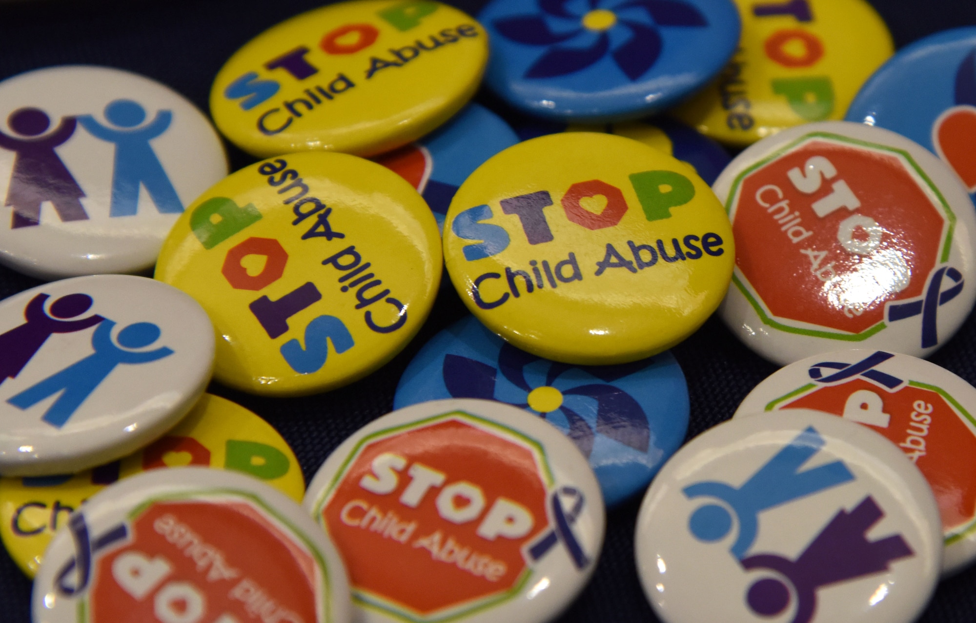 Child abuse prevention safety pins sit on display in the base exchange April 21, 2017, on Keesler Air Force Base, Miss. The family advocacy staff manned a booth with hand-outs and reading material about child abuse prevention for Keesler personnel in recognition of Child Abuse Prevention Month. (U.S. Air Force photo by Kemberly Groue)