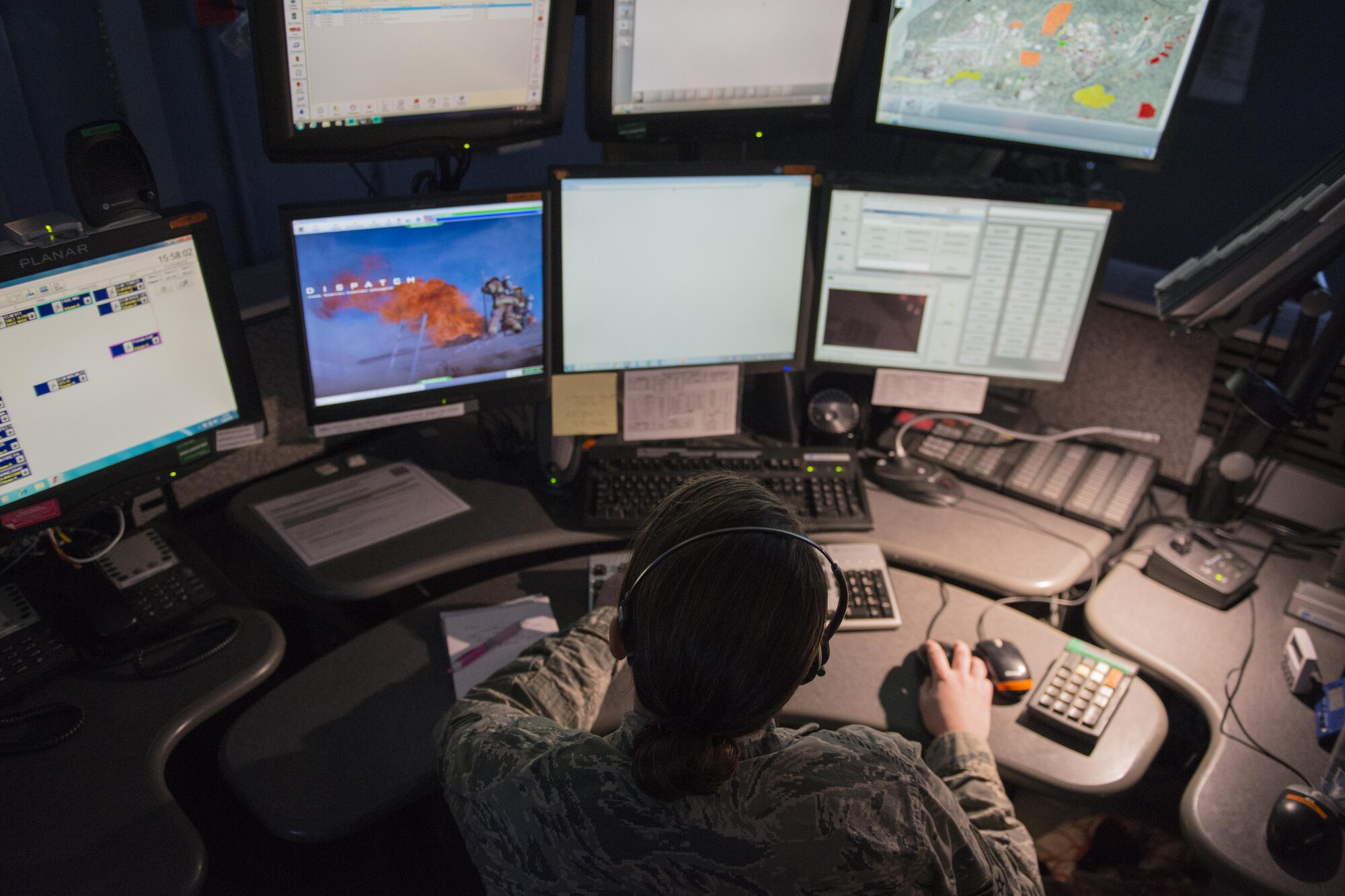Senior Airman Sarah Logodicio, 673d Civil Engineer Squadron dispatcher, answers a call at the Emergency Communications Center at Joint Base Elmendorf-Richardson, Alaska, March 10, 2017. Since September 2016, 673d Security Forces Squadron and 673d CE emergency dispatchers merged to become one ECC. 