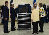 (From left) Col. Matthew Brooks, 5th Bomb Wing commander, Col. Thomas Kirkham, 5th Maintenance Group commander, and the Gantzer family unveil the dedication plaque during a ceremony at the Gantzer Maintenance Facility at Minot Air Force Base, N.D., April 21, 2017. Chief Master Sgt. Fredrick Gantzer was honored for his dedication, hard work and consistence in supporting the base and the community while serving at Minot AFB. (U.S. Air Force photo/Airman 1st Class Alyssa M. Akers)