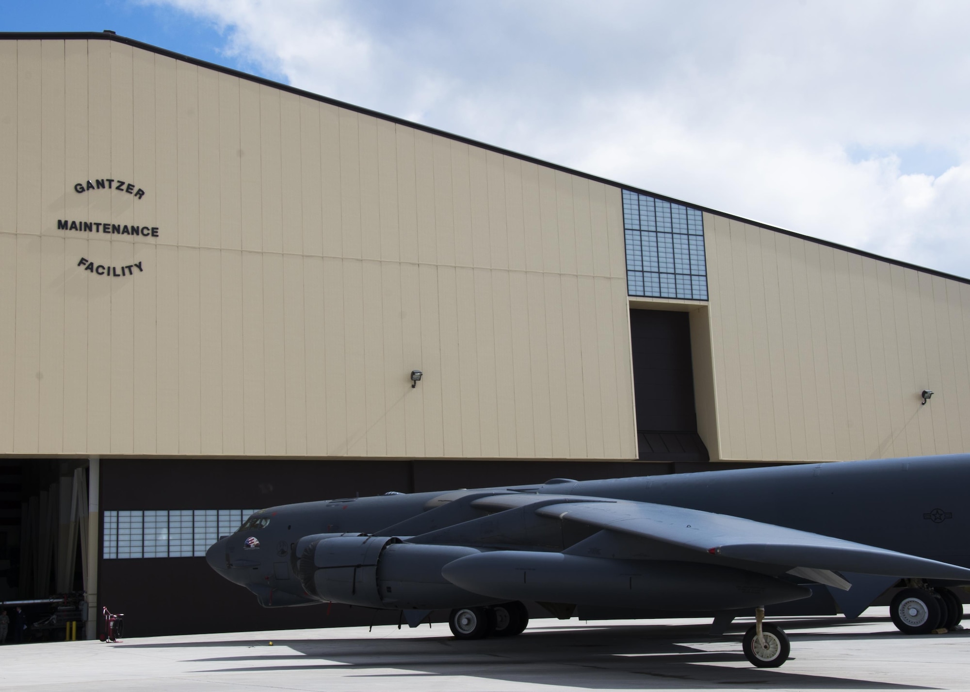 A B-52H Stratofortress sits outside of the Gantzer Maintenance Facility at Minot Air Force Base, N.D., April 21, 2017. Previously Dock 8, the hangar was renamed in honor of Chief Master Sgt. Fredrick Gantzer, an Airman who served for 31 years with over a decade at Minot AFB. (U.S. Air Force photo/Airman 1st Class Alyssa M. Akers)