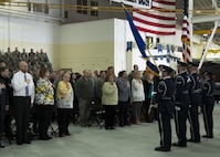 Ceremony attendees stand for the National Anthem at the Gantzer Maintenance Facility at Minot Air Force Base, N.D., April 21, 2017. The hangar was named in honor of Chief Master Sgt. Fred Gantzer, who served at Minot AFB for over a decade. (U.S. Air Force photo/Airman 1st Class Alyssa M. Akers)