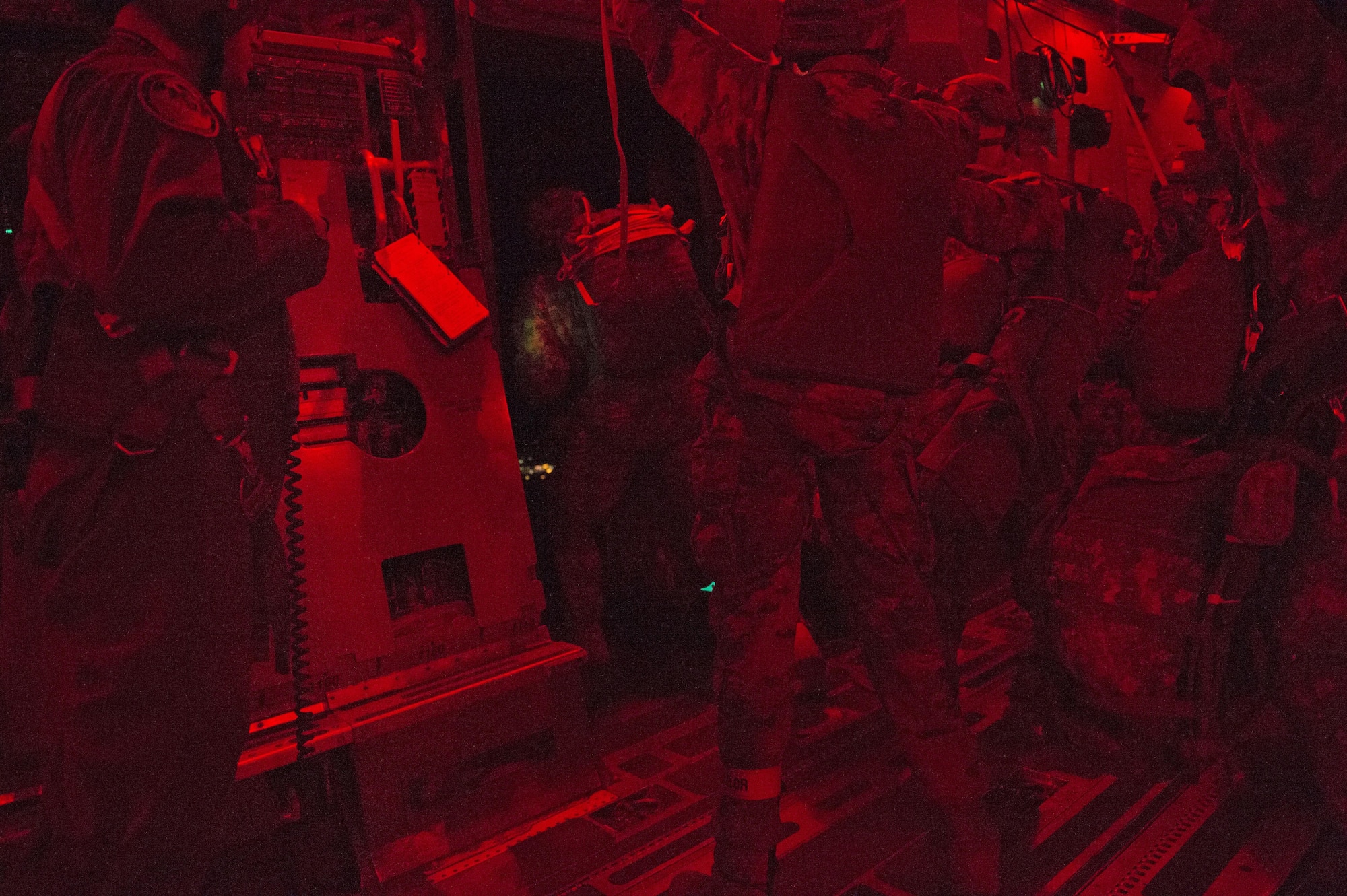 Paratroopers with the 4th Infantry Brigade Combat Team (Airborne), 25th Infantry Division, U.S. Army Alaska, jump from a C-17 Globemaster III during a night jump at the Malemute Drop Zone at Joint Base Elmendorf-Richardson, Alaska, April 18, 2017. Routine jump training is conducted to maintain proficiency and train for prospective missions. 