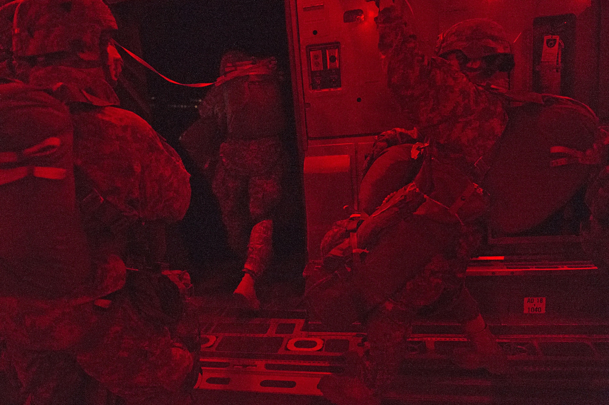 Paratroopers with the 4th Infantry Brigade Combat Team (Airborne), 25th Infantry Division, U.S. Army Alaska, jump from a C-17 Globemaster III during a night jump at the Malemute Drop Zone at Joint Base Elmendorf-Richardson, Alaska, April 18, 2017. Routine jump training is conducted to maintain proficiency and train for prospective missions. 