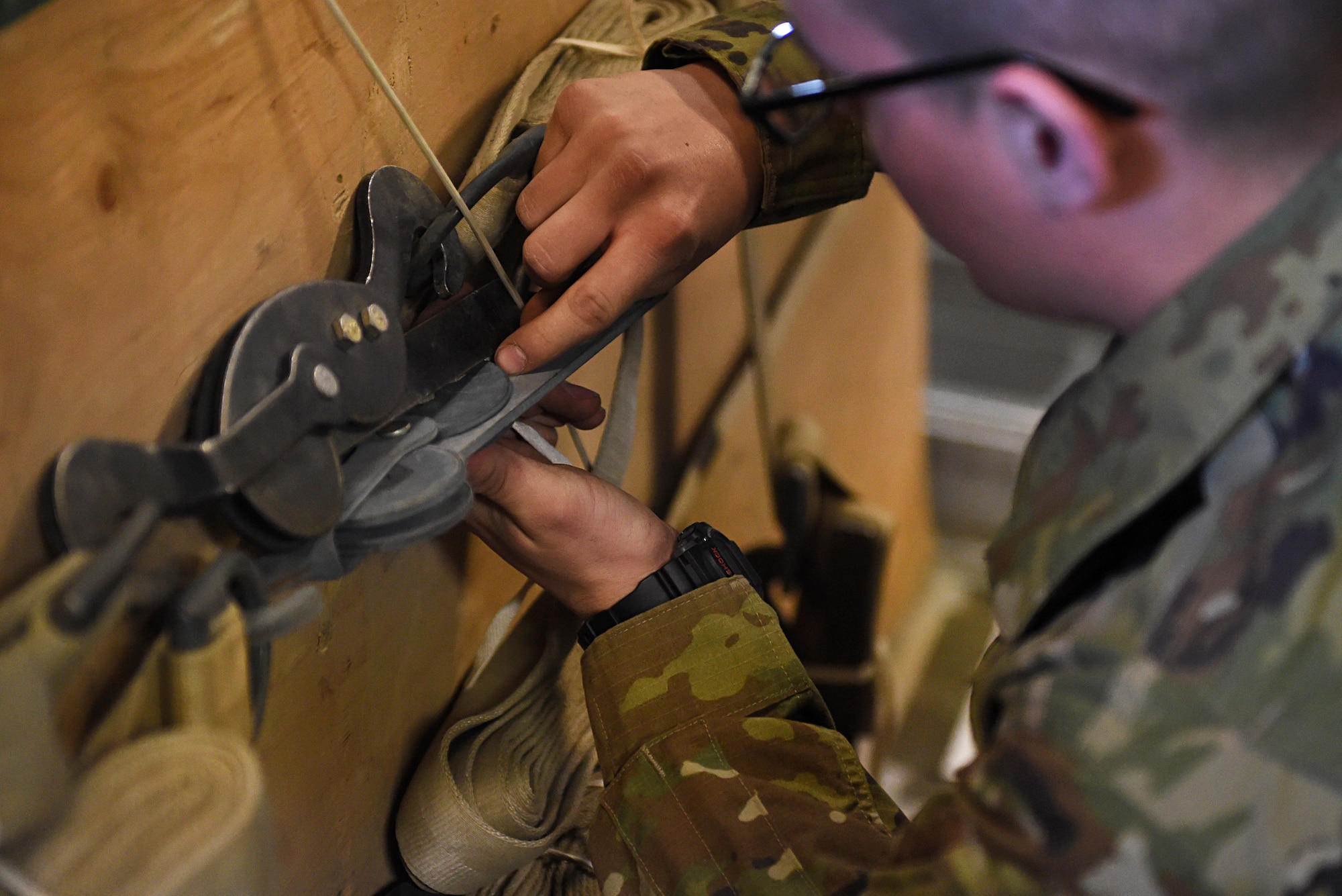 A Soldier secures straps on a cargo load at Joint Base Elmendorf-Richardson, Alaska, April 18, 2017. The cargo load was later dropped during a training mission at the Malemute Drop Zone at JBER. 