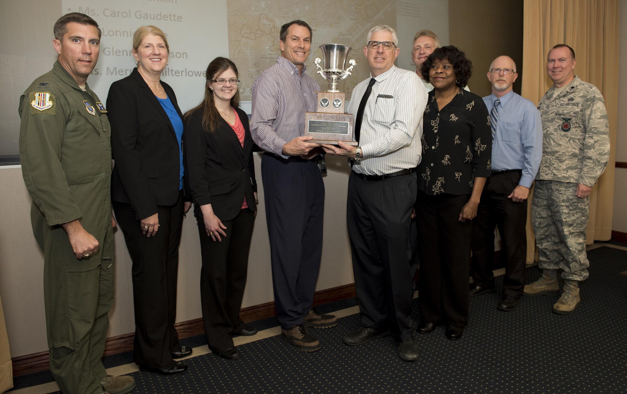 Winners of the Air Force Gen. Thomas D. White Environmental Restoration Award for Installations pose with Col. John Klein (left), 60th Air Mobility Wing commander, at the Wing Stand Up briefing April 12, Travis Air Force Base, Calif. The environmental restoration program team learned April 21 that they also won
the Secretary of Defense Environmental Restoration Award for 2017. (U.S. Air Force photo/ Heide Couch)