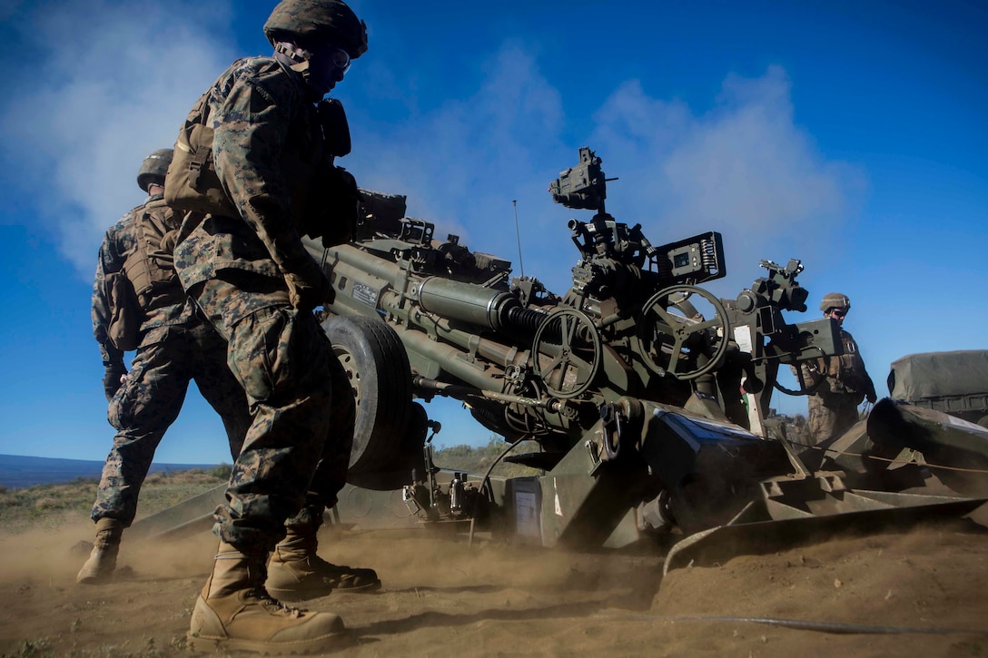 U.S. Marines with 1st Battalion, 12th Marine Regiment, Bravo Battery, operate M777A2 Howitzers at Pohakuloa Training Area, March 22, 2017. The M777A2 Howitzer is a towed artillery system used for its mobility and wide range of firing angles. (U.S. Marine Corps photo by Cpl. Alex Kouns/Released)