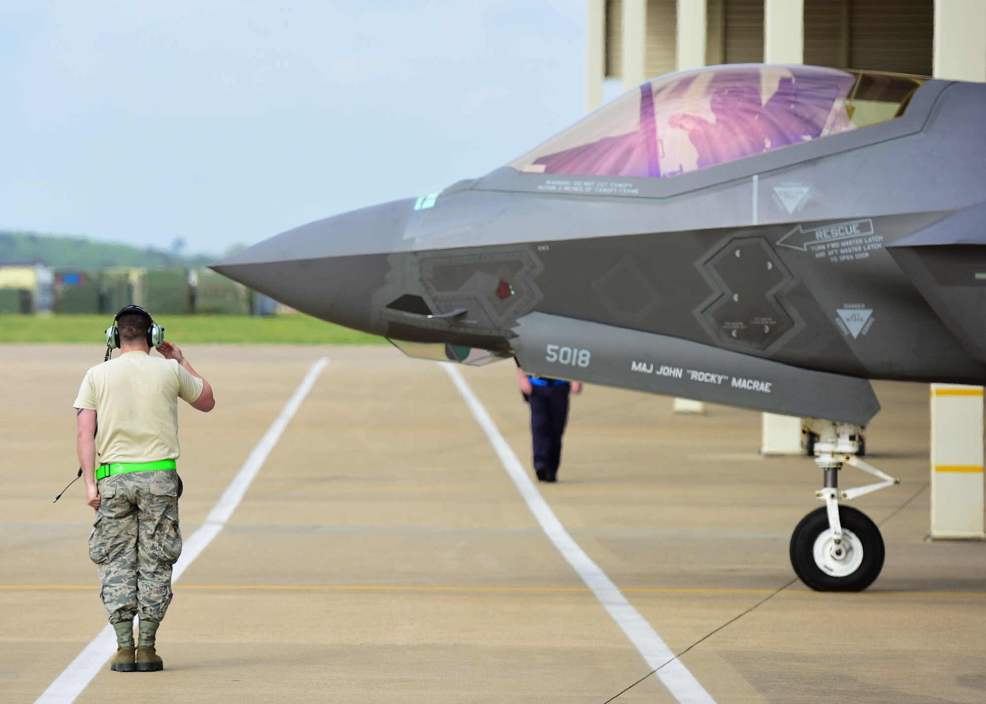 A U.S. Air Force crew chief assigned to the 58th Aircraft Maintenance Squadron, Eglin Air Force Base, Fla., salutes the F-35 Lightning II pilot as he prepares for takeoff at Joint Base Langley-Eustis, Va., April 20, 2017. With its aerodynamic performance and advanced integrated avionics, the F-35 Lightning II provides next-generation stealth, enhanced situational awareness and reduced vulnerability for the United States and allied nations. (U.S. Air Force Photo/Airman 1st Class Tristan Biese)