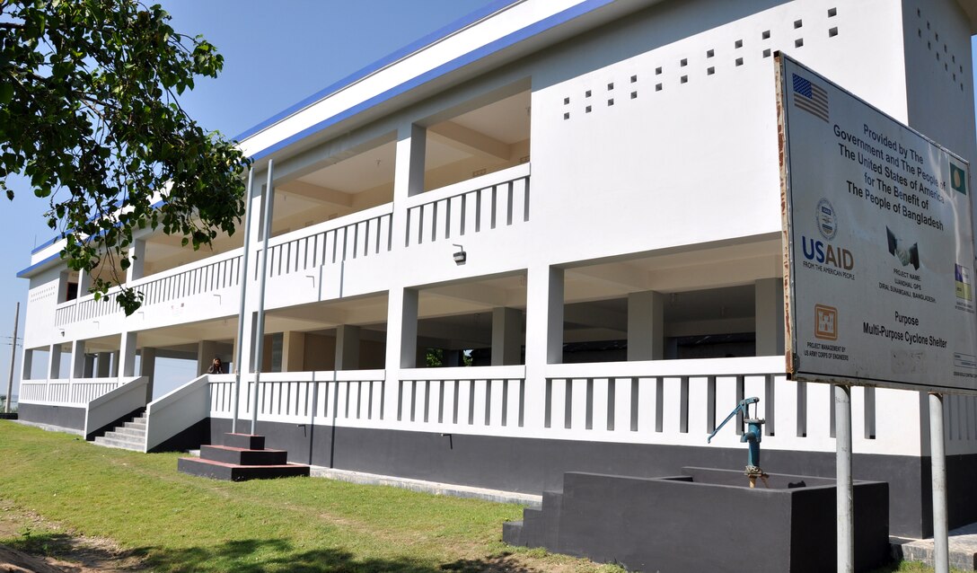 Managed by the U.S. Army Corps of Engineers – Alaska District’s Asia Office, final construction operations are wrapping up the three-year Multipurpose Cyclone Shelter and School Program with the financial assistance from U.S. Agency for International Development. Shown here, students show their school spirit at one of the newly constructed facilities.