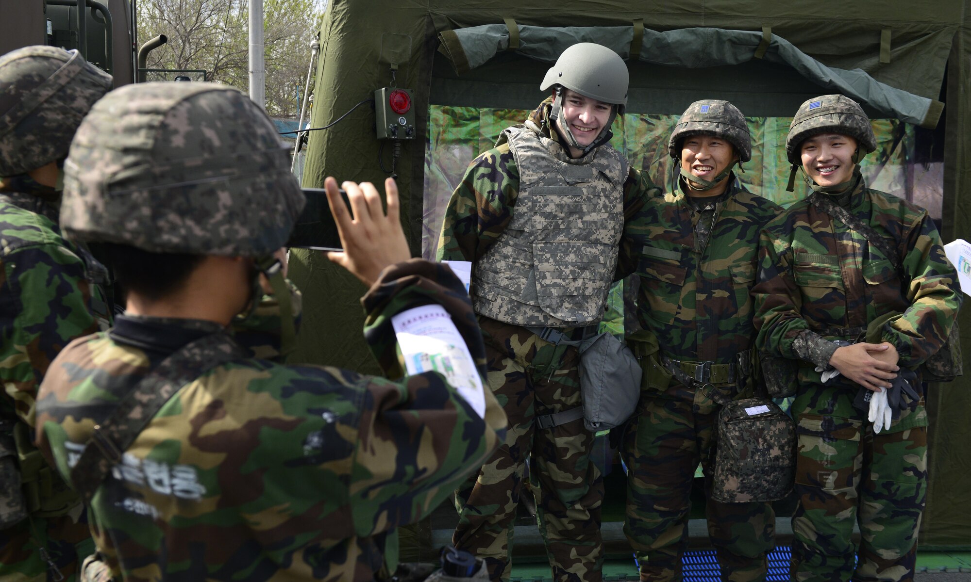 U.S. and Republic of Korea Airmen take a photo during the ROK/U.S. Combined Chemical, Biological, Radiological, and Nuclear Field Training Exercise at Daegu Air Base, April 20, 2017. Airmen from the allied countries strengthened bonds and forged friendships during the exercise. (U.S. Air Force photo by Staff Sgt. Alex Fox Echols III)