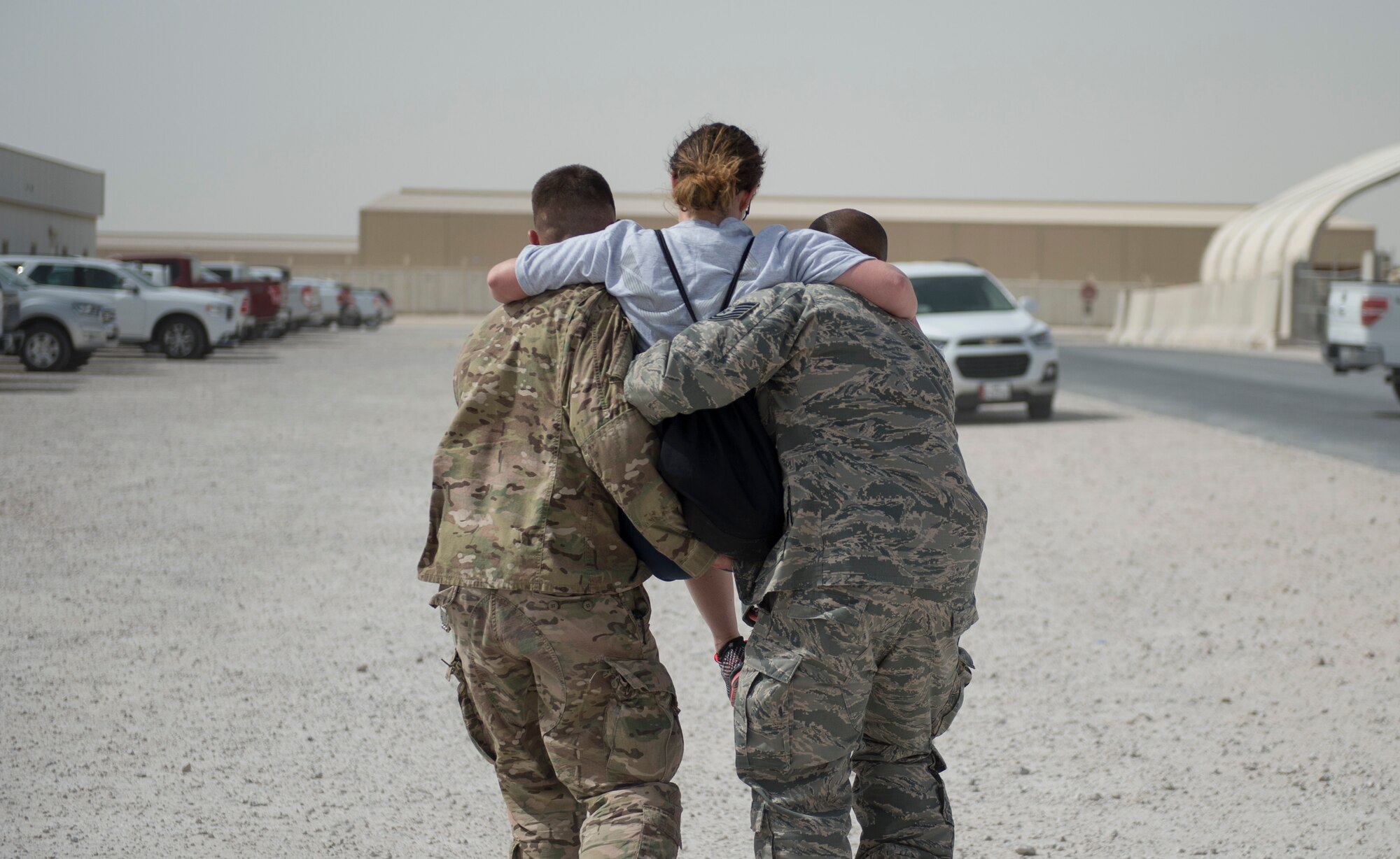 U.S. Air Force Airmen from the 379th Expeditionary Air Expeditionary Wing carries a simulated wounded airman to safety at Al Udeid Air Base, Qatar, April 17, 2017. The active shooter exercise tested the skills and abilities of Airmen to work with other units in in order to gain a better understanding of each other’s roles in the event of a real-world situation.   (U.S. Air Force photo by Tech. Sgt. Amy M. Lovgren)
