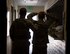 A member of the 379th Expeditionary Security Forces Squadron, left, escorts a role player out of a building at Al Udeid Air Base, Qatar, April 17, 2017. The active shooter exercise tested the skills and abilities of Airmen to work with other units in in order to gain a better understanding of each other’s roles in the event of a real-world situation.   (U.S. Air Force photo by Tech. Sgt. Amy M. Lovgren)