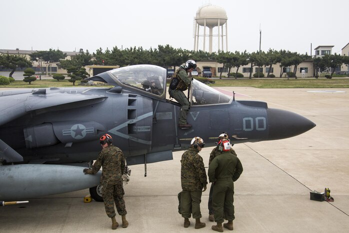 U.S. Marine Corps Capt. Paul Gucwa, an AV-8B Harrier pilot with Marine Attack Squadron (VMA) 311, exits the aircraft after concluding a defensive counter air mission during Exercise MAX THUNDER 17 at Kunsan Air Base, Republic of Korea, April 17, 2017. Max Thunder serves as an opportunity for U.S. and ROK forces to train together and sharpen tactical skills for the defense of the Asia-Pacific region. It is an annual military-flying exercise built to promote interoperability between U.S. and ROK forces. (U.S. Marine Corps photo by Lance Cpl. Carlos Jimenez)