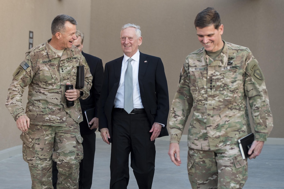 Defense Secretary Jim Mattis speaks with Army Gen. Joseph Votel, commander of U.S. Central Command, right, and  Army Maj. Gen. Ralph Groover at Centcom's Forward Headquarters at Al Udeid Air Base in Qatar, April 22, 2017. DoD photo by Air Force Tech. Sgt. Brigitte N. Brantley