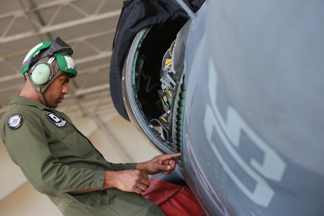 U.S. Marine Corps Sgt. Chase Baker, an airframes mechanic deployed in support of Combined Joint Task Force – Operation Inherent Resolve, assigned to Marine Attack Squadron 231, Special Purpose Marine Air-Ground Task Force-Crisis Response-Central Command, conducts a maintenance check of an AV-8B Harrier, Feb. 27, 2017. SPMAGTF-CR-CC continues its commitment to support CJTF-OIR and USCENTCOM through employment of kinetic air strike missions, security cooperation and crisis response assets within the region. CJTF-OIR is the global Coalition to defeat ISIS in Iraq and Syria. (U.S. Marine Corps photo by Staff Sgt. Jennifer B. Poole)