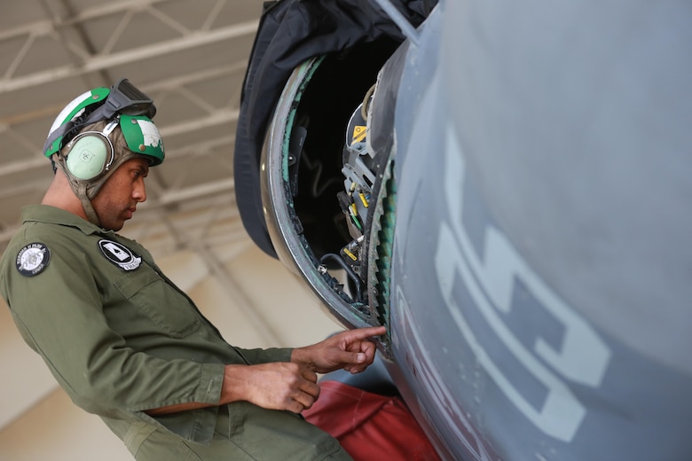 U.S. Marine Corps Sgt. Chase Baker, an airframes mechanic deployed in support of Combined Joint Task Force – Operation Inherent Resolve, assigned to Marine Attack Squadron 231, Special Purpose Marine Air-Ground Task Force-Crisis Response-Central Command, conducts a maintenance check of an AV-8B Harrier, Feb. 27, 2017. SPMAGTF-CR-CC continues its commitment to support CJTF-OIR and USCENTCOM through employment of kinetic air strike missions, security cooperation and crisis response assets within the region. CJTF-OIR is the global Coalition to defeat ISIS in Iraq and Syria. (U.S. Marine Corps photo by Staff Sgt. Jennifer B. Poole)
