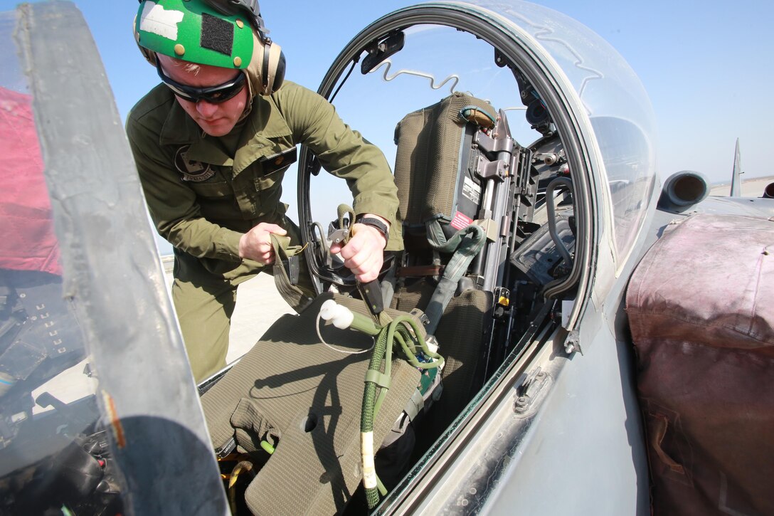 U.S. Marine Corps Lance Cpl. Nathan Derouin, a safety equipment mechanic deployed in support of Combined Joint Task Force – Operation Inherent Resolve, assigned to Marine Attack Squadron 231, Special Purpose Marine Air-Ground Task Force-Crisis Response-Central Command, replaces an ejection seat in AV-8B Harrier while forward deployed in the Middle East, Feb. 27, 2017.  SPMAGTF-CR-CC continues its commitment to support OIR and USCENTCOM through employment of kinetic air strike missions, security cooperation and crisis response assets within the region. CJTF-OIR is the global Coalition to defeat ISIS in Iraq and Syria. (U.S. Marine Corps photo by   Staff Sgt. Jennifer B. Poole 