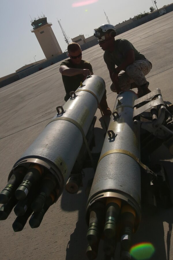 U.S. Marine Corps Cpl. Patrick Poore, an aviation ordnance technician, and Gunnery Sgt. Kitchell Mortimer, quality assurance chief deployed in support of Combined Joint Task Force – Operation Inherent Resolve, assigned to Marine Attack Squadron 231, Special Purpose Marine Air-Ground Task Force-Crisis Response-Central Command, conducts pre-flight checks, Feb. 27, 2017.  SPMAGTF-CR-CC continues its commitment to support OIR and USCENTCOM through employment of kinetic air strike missions, security cooperation and crisis response assets within the region. CJTF-OIR is the global Coalition to defeat ISIS in Iraq and Syria. (U.S. Marine Corps photo by   Staff Sgt. Jennifer B. Poole)