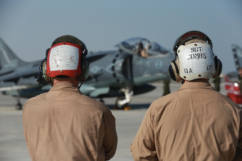 U.S. Marine Corps Cpl. Stephen Gibbs, an ordnance technician deployed in support of Combined Joint Task Force – Operation Inherent Resolve, assigned to Marine Attack Squadron 231, Special Purpose Marine Air-Ground Task Force-Crisis Response-Central Command, and Sgt. Brandon Combs, a quality assurance technician with VMA-231, SPMAGTF-CR-CC, watch a pre-flight inspection, Feb. 27, 2017. SPMAGTF-CR-CC continues its commitment to support OIR and USCENTCOM through employment of kinetic air strike missions, security cooperation and crisis response assets within the region. CJTF-OIR is the global Coalition to defeat ISIS in Iraq and Syria. (U.S. Marine Corps photo by   Staff Sgt. Jennifer B. Poole )
