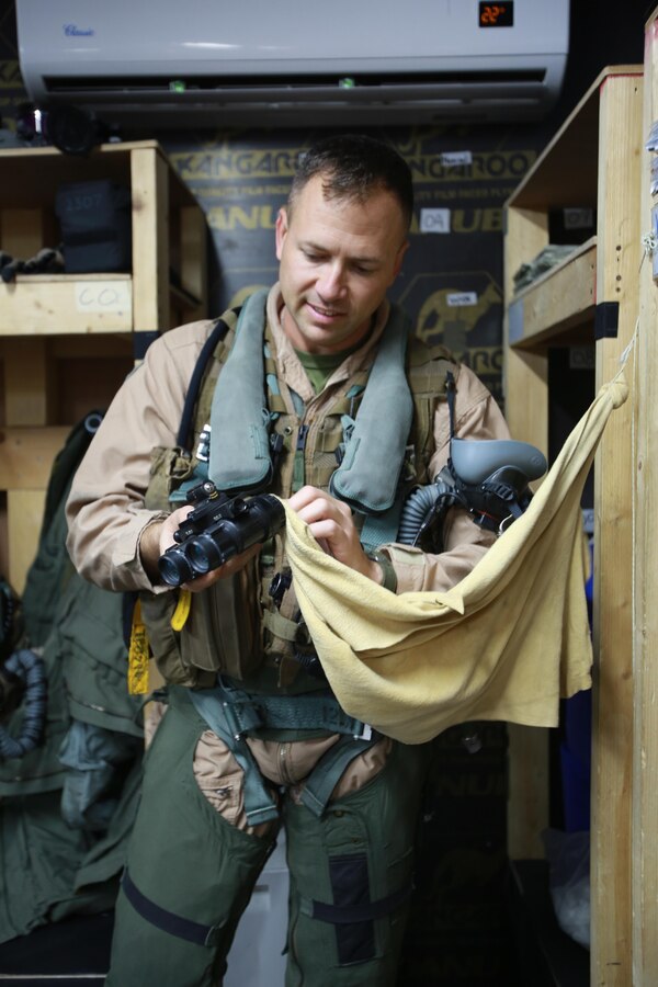 U.S. Marine Corps Maj. Trevor Felter, executive officer and AV-8B Harrier pilot deployed in support of Combined Joint Task Force – Operation Inherent Resolve, assigned to  Marine Attack Squadron 231, Special Purpose Marine Air-Ground Task Force-Crisis Response-Central Command, conducts a pre-flight check of his safety survival equipment, Feb. 28, 2017. SPMAGTF-CR-CC continues its commitment to support OIR and USCENTCOM through employment of kinetic air strike missions, security cooperation and crisis response assets within the region. CJTF-OIR is the global Coalition to defeat ISIS in Iraq and Syria. (U.S. Marine Corps photo by Staff Sgt. Jennifer B. Poole)