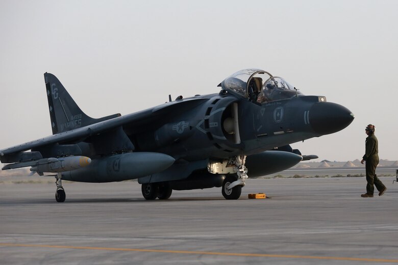 U.S. Marine Corps Lance Cpl. Dylan Potts, a powerline mechanic deployed in support of Combined Joint Task Force – Operation Inherent Resolve, assigned to  Marine Attack Squadron 231, Special Purpose Marine Air-Ground Task Force-Crisis Response-Central Command, conducts pre-flight checks with Lt. Ben Britten, an AV-8B Harrier pilot with the Royal Navy, , March 2, 2017. SPMAGTF-CR-CC continues its commitment to support OIR and USCENTCOM through employment of kinetic air strike missions, security cooperation and crisis response assets within the region. CJTF-OIR is the global Coalition to defeat ISIS in Iraq and Syria. (U.S. Marine Corps photo by  Staff Sgt. Jennifer B. Poole)