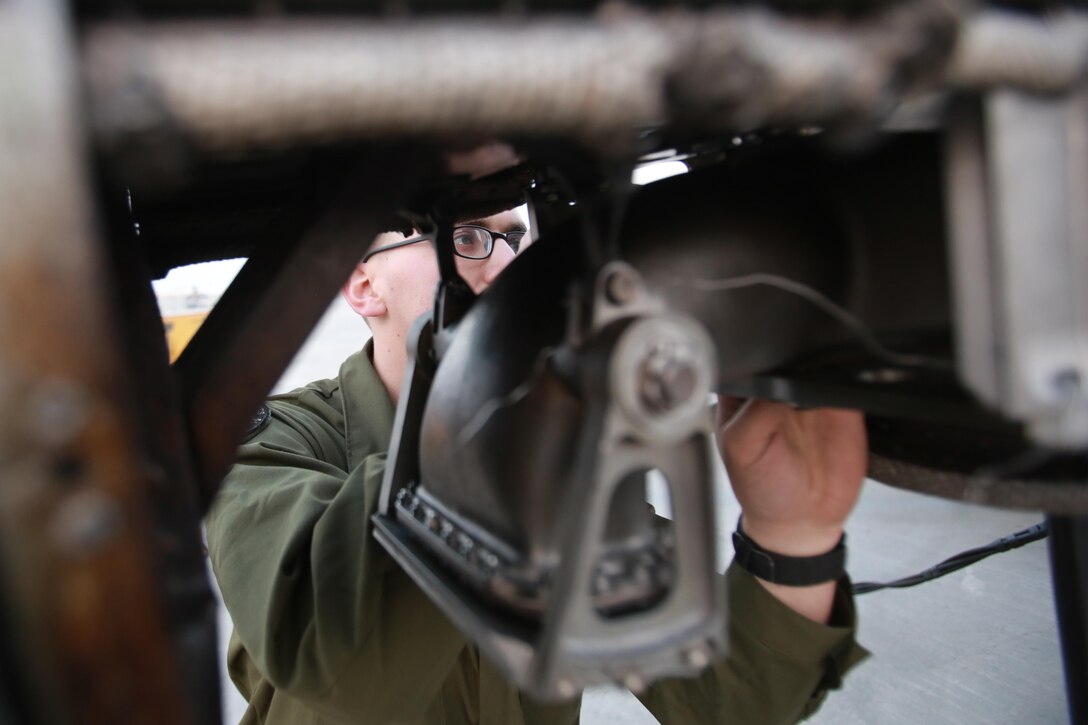 U.S. Marine Corps Cpl. Jacob Miller, an airframes mechanic deployed in support of Combined Joint Task Force – Operation Inherent Resolve, assigned to Marine Attack Squadron 231, Special Purpose Marine Air-Ground Task Force-Crisis Response-Central Command, conducts a pre-flight check on an AV-8B Harrier, March 2, 2017. SPMAGTF-CR-CC continues its commitment to support OIR and USCENTCOM through employment of kinetic air strike missions, security cooperation and crisis response assets within the region. CJTF-OIR is the global Coalition to defeat ISIS in Iraq and Syria. (U.S. Marine Corps photo by  Staff Sgt. Jennifer B. Poole)