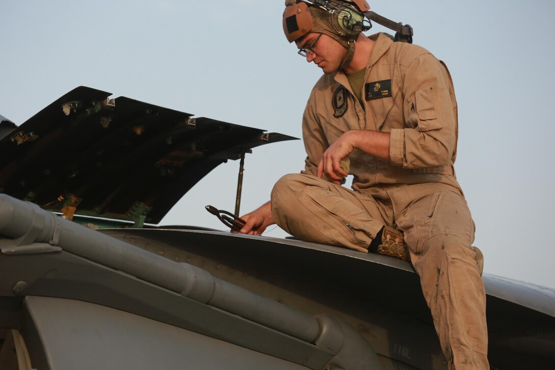 U.S. Marine Corps Lance Cpl. Tyler Summ, a fixed wing aircraft mechanic deployed in support of Combined Joint Task Force – Operation Inherent Resolve, assigned to  Marine Attack Squadron 231, Special Purpose Marine Air-Ground Task Force-Crisis Response-Central Command, conducts a pre-flight maintenance check, March 2, 2017. SPMAGTF-CR-CC continues its commitment to support OIR and USCENTCOM through employment of kinetic air strike missions, security cooperation and crisis response assets within the region. CJTF-OIR is the global Coalition to defeat ISIS in Iraq and Syria. (U.S. Marine Corps photo by Staff Sgt. Jennifer B. Poole)