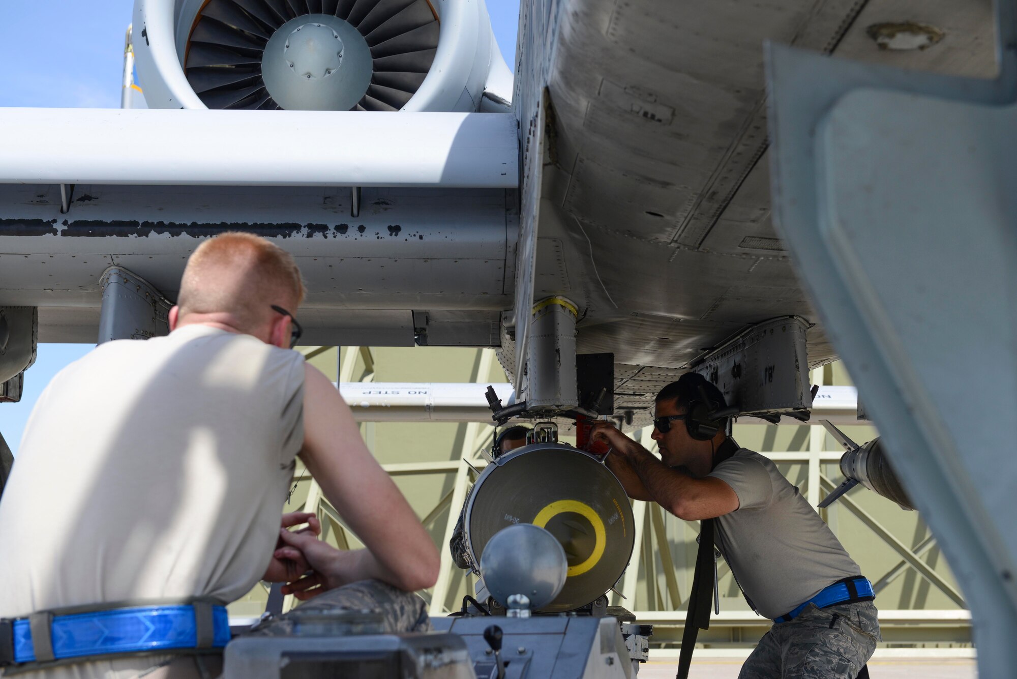 U.S. Air Force Senior Airman Michael Sherwood (left), 447th Expeditionary Aircraft Maintenance Squadron aircraft armament systems journeyman, drives a jammer, while Staff Sgt. Wesley Gasper, also a 447th Expeditionary Aircraft Maintenance Squadron aircraft armament systems journeyman, aligns a GBU-31 onto an A-10 Thunderbolt II April 12, 2017, at Incirlik Air Base, Turkey. The munitions loaded are used in aide of Operation INHERENT RESOLVE. (U.S. Air Force photo by Airman 1st Class Devin M. Rumbaugh)