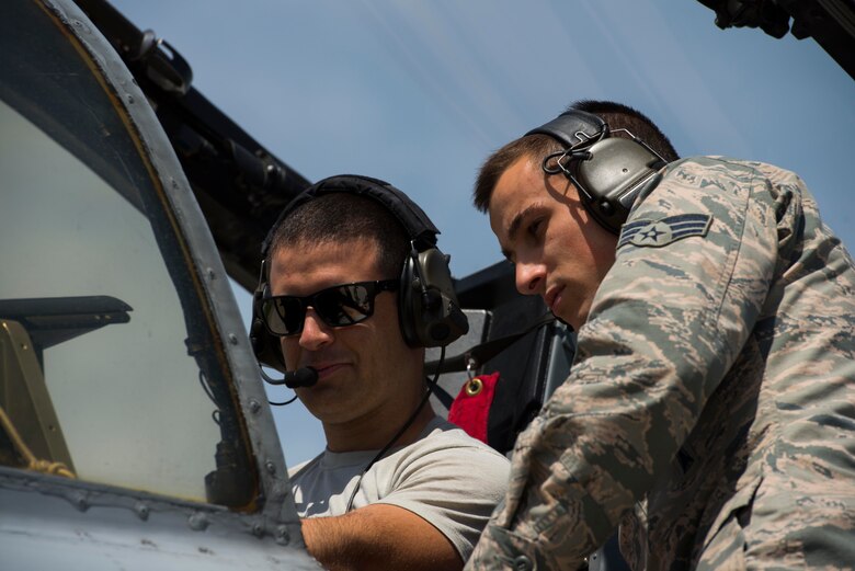 U.S. Air Force Staff Sgt. Wesley Gasper (left), and Senior Airman Austin Debaugh, both 447th Expeditionary Aircraft Maintenance Squadron aircraft armament systems journeymen, inspect an A-10 Thunderbolt II April 12, 2017, at Incirlik Air Base, Turkey. The A-10 requires tests to be run to verify the munitions onboard communicate properly with the systems on the aircraft. (U.S. Air Force photo by Airman 1st Class Devin M. Rumbaugh)