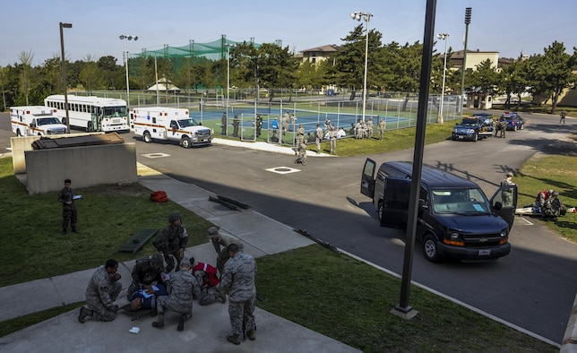United States Air Force members assigned to the 8th Medical Group and Republic of Korea Air Force medical airmen participate in a mass causality exercise at Kunsan Air Base, Republic of Korea, April 19, 2017. The scenario involved a vehicle crash and explosion, which injured 10 USAF personnel and five ROKAF personnel. U.S. and ROK airmen conducted the training to evaluate their ability to communicate and operate through a MASCAL situation. (U.S. Air Force Photo by Senior Airman Colville McFee/Released)