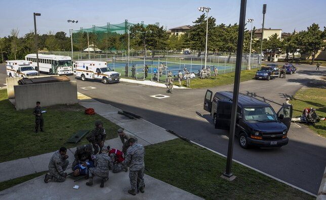 United States Air Force members assigned to the 8th Medical Group and Republic of Korea Air Force medical airmen participate in a mass causality exercise at Kunsan Air Base, Republic of Korea, April 19, 2017. The scenario involved a vehicle crash and explosion, which injured 10 USAF personnel and five ROKAF personnel. U.S. and ROK airmen conducted the training to evaluate their ability to communicate and operate through a MASCAL situation. (U.S. Air Force Photo by Senior Airman Colville McFee/Released)
