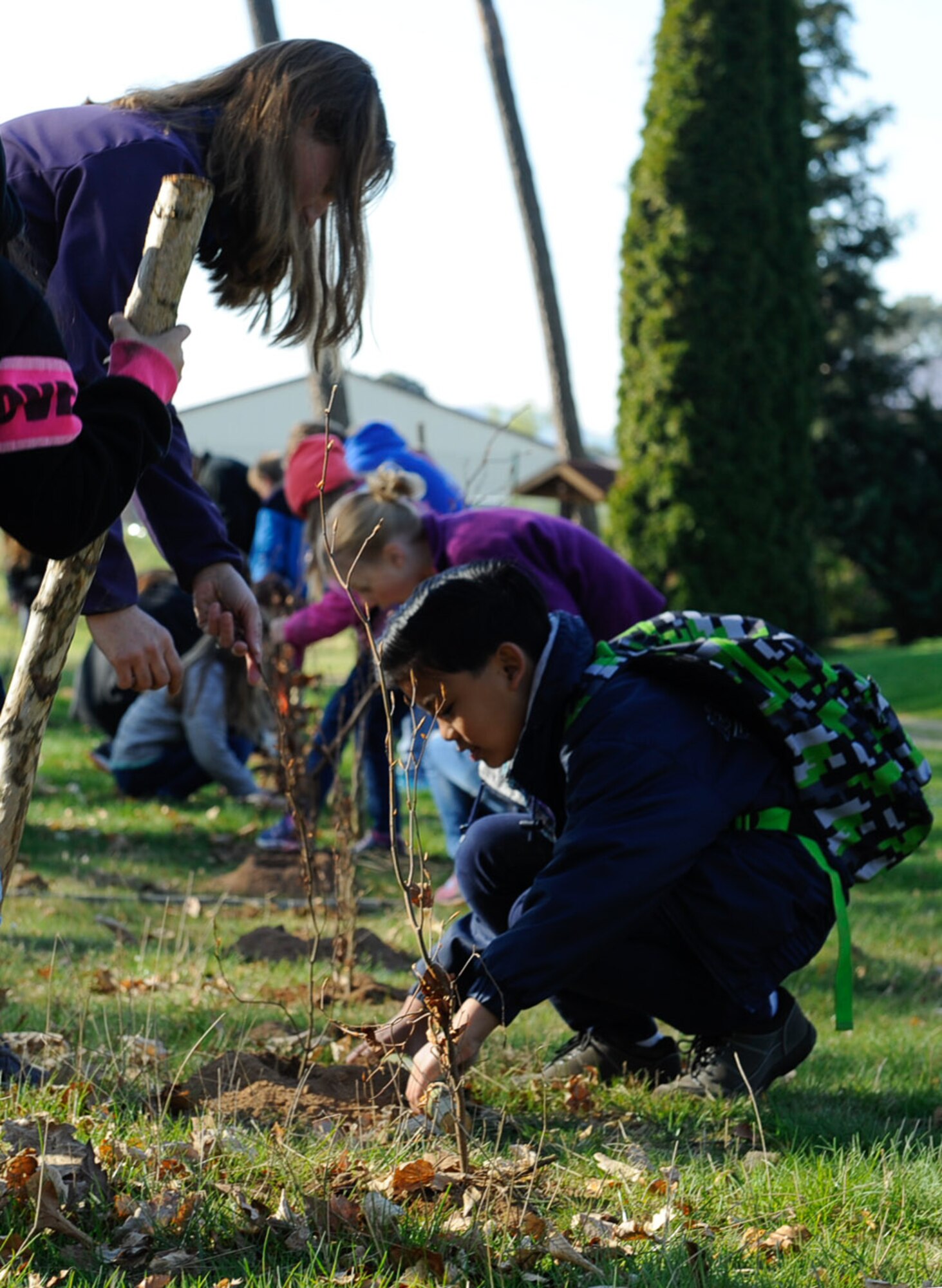 Kaiserslautern Military Community students plant trees in celebration of Earth Day on Ramstein Air Base, Germany, April 21, 2017. This year, more than 85 students and teachers helped plant more than 1,500 trees. (U.S. Air Force photo by Airman 1st Class Savannah L. Waters)