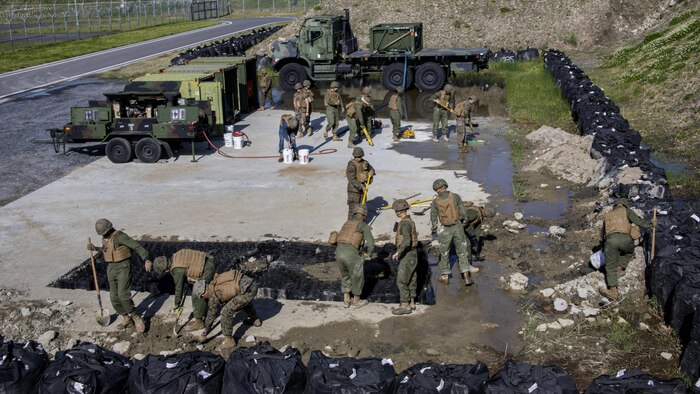 U.S. Marines with Marine Wing Support Squadron 171, execute airfield damage and repair training at Marine Corps Air Station Iwakuni, Japan, April 19, 2017. The ADR training required Marines to utilize their skill set to tactically and proficiently fix any anomalies to a simulated damaged airfield. The training focused on becoming more efficient in situations that may require Marines to act in real-world scenarios to maintain the tempo of aircraft operations. 