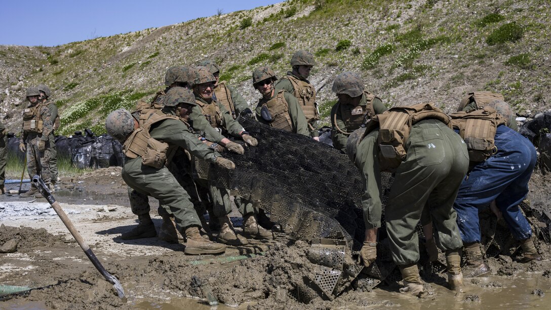 U.S. Marines with Marine Wing Support Squadron 171, prepare a simulated crater in the runway for repair during airfield damage and repair training at Marine Corps Air Station Iwakuni, Japan, April 19, 2017. The ADR training required Marines to utilize their skill set to tactically and proficiently fix any anomalies to a simulated damaged airfield. The training focused on becoming more efficient in situations that may require Marines to act in real-world scenarios to maintain the tempo of aircraft operations.