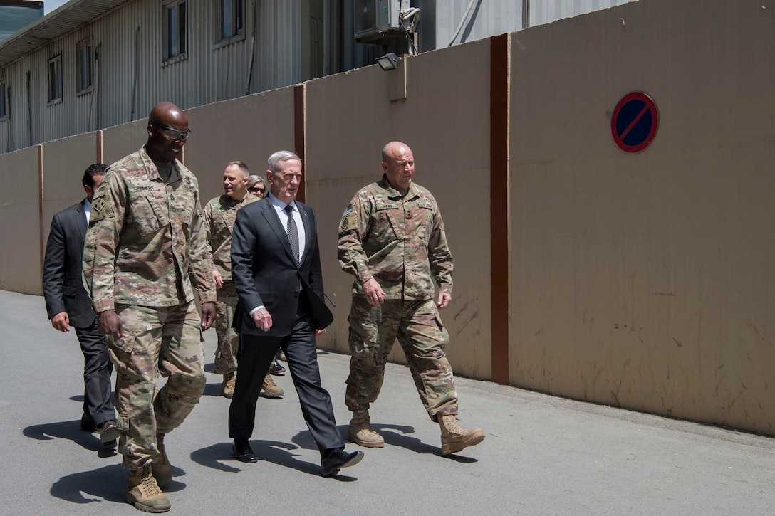 Defense Secretary Jim Mattis walks with Army Command Sgt. Maj David Clark, left, Resolute Support senior enlisted leader, and Army Maj. Gen. Christopher Haas, Resolute Support deputy chief of staff for operations, at the mission's headquarters in Kabul, Afghanistan, April 24, 2017. DoD photo by Air Force Tech. Sgt. Brigitte N. Brantley
