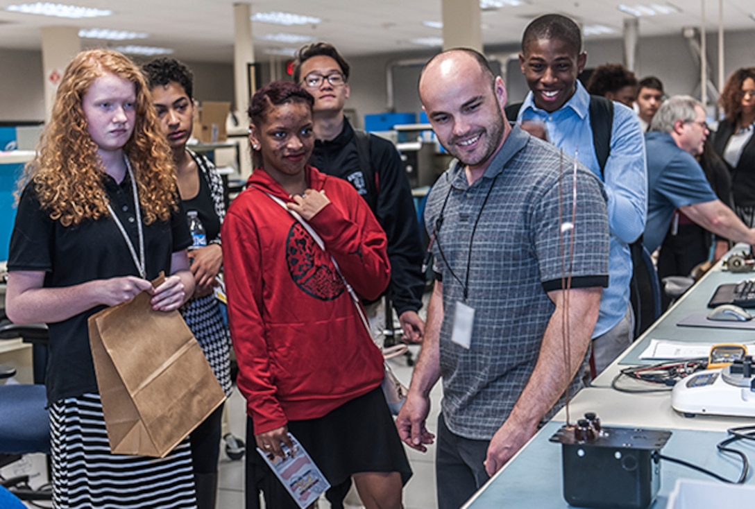Whitehall-Yearling students visit the test lab at Defense Supply Center Columbus and recieve hands on training during "A day in the life of a mentor" event on Apr. 20.
