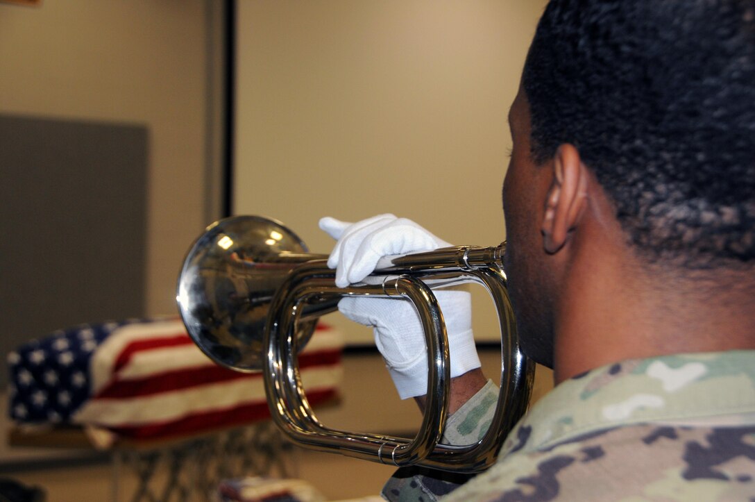 Sgt. 1st Class Rodrecus Donnings, a petroleum supply noncommissioned officer from Tallahassee, Florida currently assigned to the U.S. Army Reserve’s 716th Quartermaster Company, practices proper taps techniques April 20 during military funeral honors training at 99th Regional Support Command headquarters on Joint Base McGuire-Dix-Lakehurst, New Jersey.  The 99th RSC supports the casualty mission by providing support and assistance to families of Soldiers and Department of Army civilians reported as a casualty (deceased, missing, or whereabouts unknown).