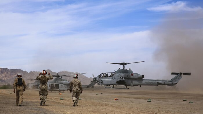 Ordnance Marines move toward an AH-1Z Viper as it lands during operations that are a part of Assault Support Training 1 in support of the semiannual Weapons and Tactics Instructor Course 2-17, at the Chocolate Mountain Aerial Gunnery Range, California, April 17. Lasting seven weeks, WTI is a training evolution hosted by MAWTS-1 which provides standardized advanced and tactical training and certification of unit instructor qualifications to support Marine aviation training and readiness. 