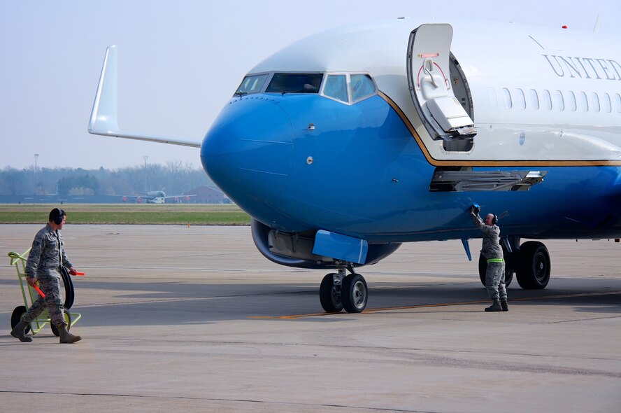 Air Force Reserve Command pilots (in the cockpit window) and maintainers outside on the ground, work together on the flight line, checking over a 932nd Airlift Wing plane, as one C-40C is prepped and awaits a mission March 21, 2017, at Scott Air Force Base, Illinois. The C-40C aircraft is used to transport the nation's distinguished visitor mission worldwide as part of the 932nd Airlift Wing, under 22nd Air Force, Air Force Reserve Command. The unit is made up of four groups which include the 932nd Mission Support Group, Medical Group, Operations Group and Maintenance Group. All work together to help improve the overall mission of the wing in Illinois. (U.S. Air Force photo by Lt. Col. Stan Paregien)
