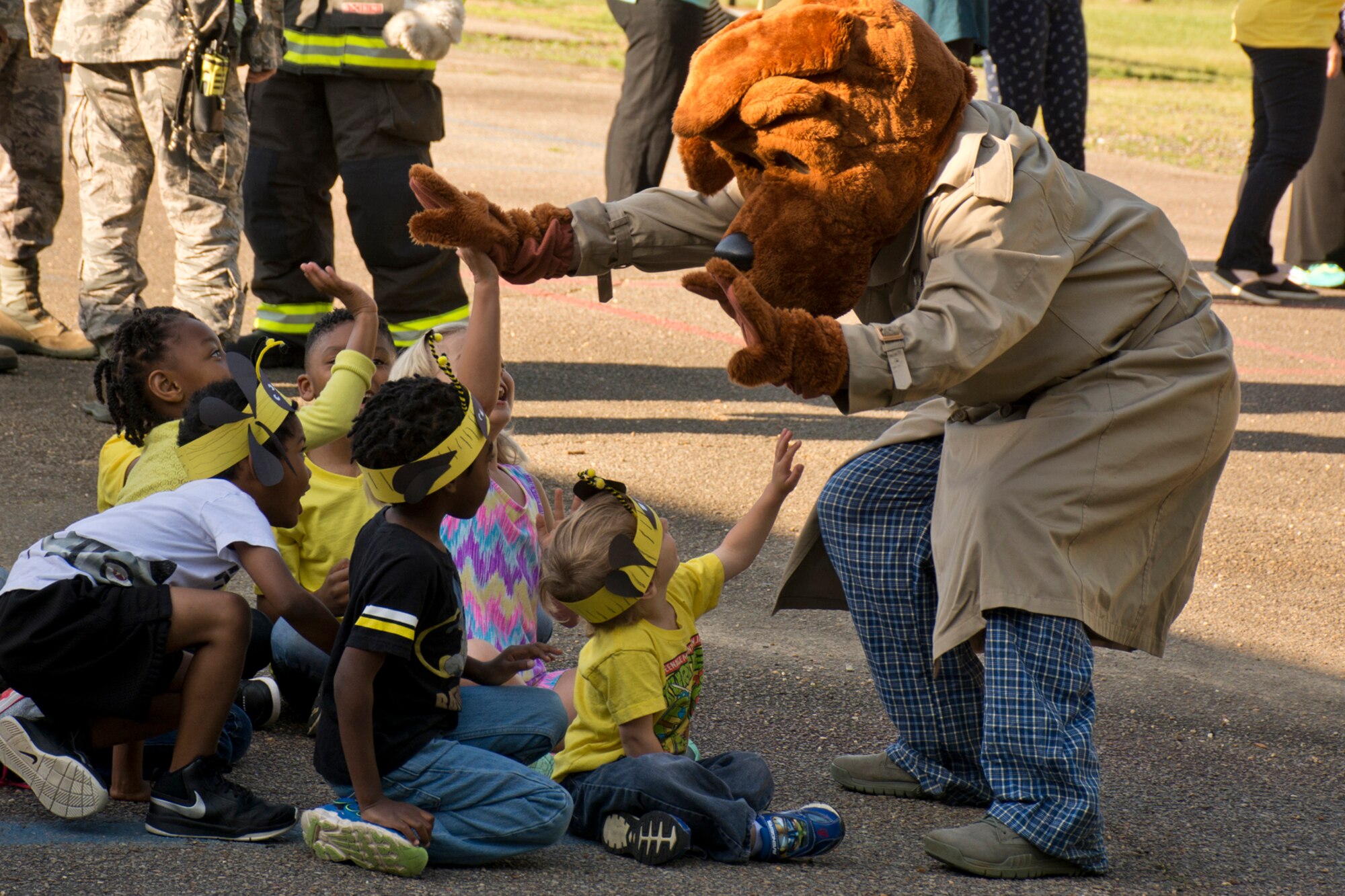 McGruff the Crime Dog interacts with students during the Earth Day Expo at Arnold Drive Elementary School April 20, 2017, at Little Rock Air Force Base, Ark. Smokey Bear and Sparky the Fire Dog were also in attendance at the event, which commemorated Earth Day and taught students about conservation and how they can protect the environment. (U.S. Air Force photo by Master Sgt. Jeff Walston/Released)