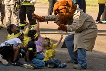 McGruff the Crime Dog interacts with students during the Earth Day Expo at Arnold Drive Elementary School April 20, 2017, at Little Rock Air Force Base, Ark. Smokey Bear and Sparky the Fire Dog were also in attendance at the event, which commemorated Earth Day and taught students about conservation and how they can protect the environment. (U.S. Air Force photo by Master Sgt. Jeff Walston/Released)