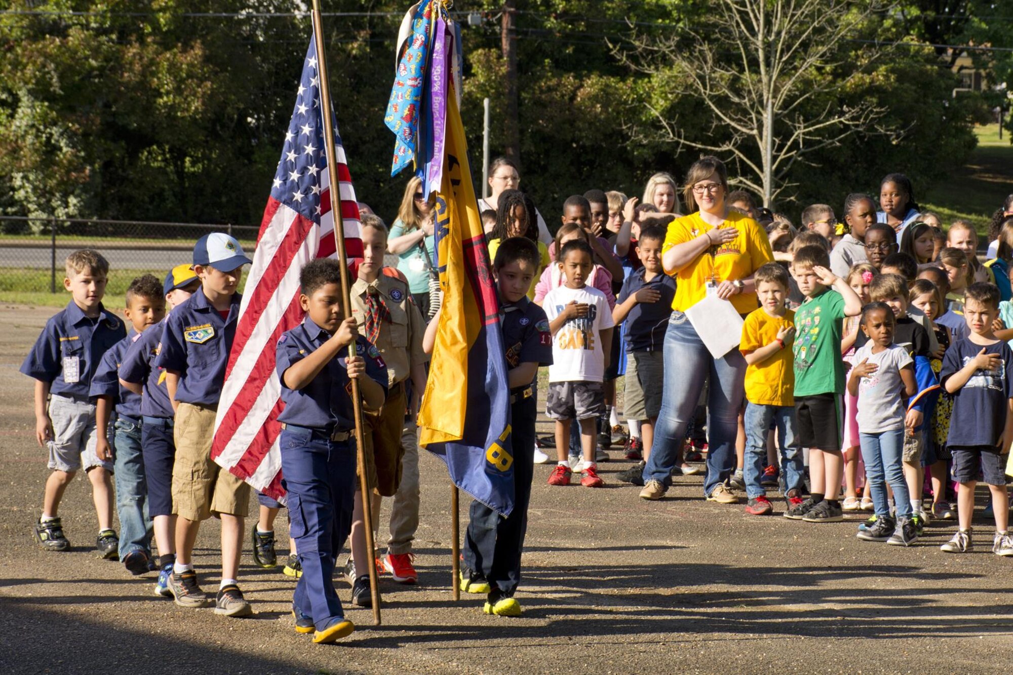Members of Cub Scout Pack 170 post the colors during the Arnold Drive Elementary School Earth Day Expo April 20, 2017, at Little Rock Air Force Base, Ark. The pack, which is located on base, planted fruit trees to attract pollinators such as bees, wasps, humming birds and butterflies. (U.S. Air Force photo by Master Sgt. Jeff Walston/Released)