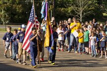 Members of Cub Scout Pack 170 post the colors during the Arnold Drive Elementary School Earth Day Expo April 20, 2017, at Little Rock Air Force Base, Ark. The pack, which is located on base, planted fruit trees to attract pollinators such as bees, wasps, humming birds and butterflies. (U.S. Air Force photo by Master Sgt. Jeff Walston/Released)