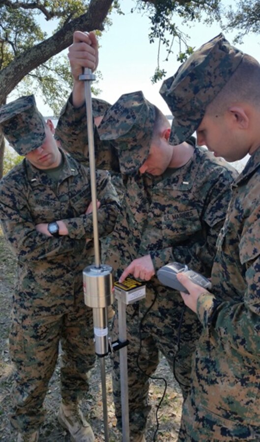 On March 9, 2017, Marines attached to Combat Engineer Officer course 3-17 (CEO 2-17) use the Dual Mass, Dynamic Cone Pentrometer to test the bearing capacity of the soil. During their period of instruction, CEO students learn soil properties and characteristics, how to test soil composition, and what to stabilize a given soil with; in order to plan for horizontal construction projects. Pictured from left to right:  Second Lieutenants Jacob Ridings, Alexander Irwin, and Dylan Chung.
