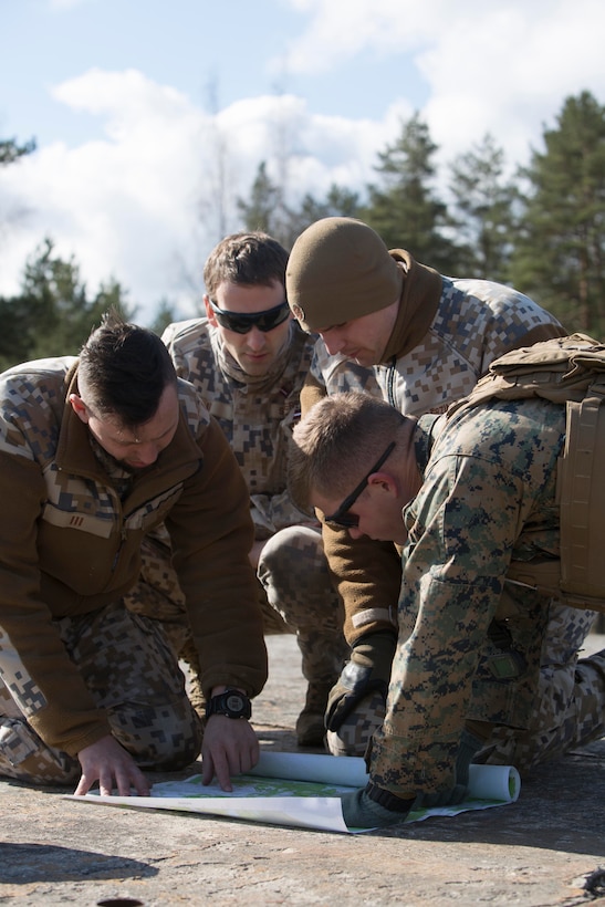 A Marine and Latvian soldiers plan for combined anti-armor training on Adazi Military Base, Latvia, April 19, 2017. Exercise Summer Shield is a NATO multinational training exercise. Marine Corps photo by Sgt. Patricia A. Morris