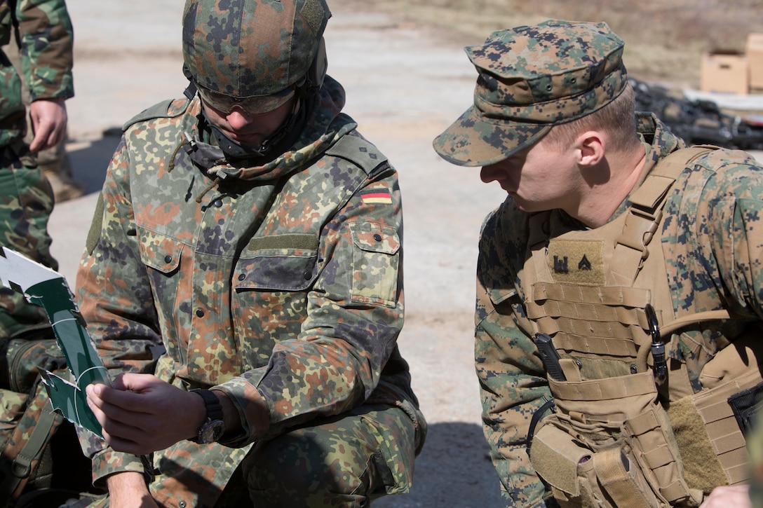 A Marine and a German soldier begin Exercise Summer Shield on Adazi Military Base, Latvia, April 20, 2017. Exercise Summer Shield is a multinational NATO exercise. Marine Corps photo by Sgt. Patricia A. Morris