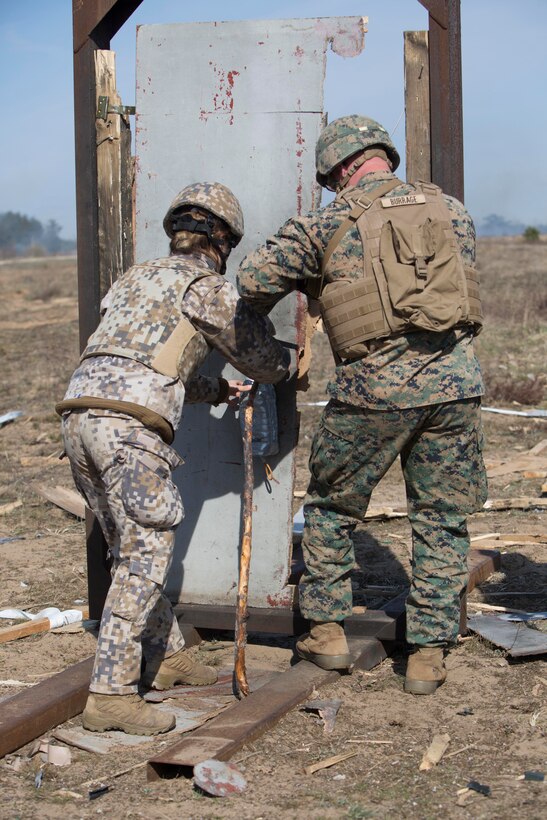 A Marine and a Latvian soldier prepare a water charge during breach training at Exercise Summer Shield on Adazi Military Base, Latvia, April 20, 2017. Exercise Summer Shield is a multinational NATO exercise. Marine Corps photo by Sgt. Patricia A. Morris