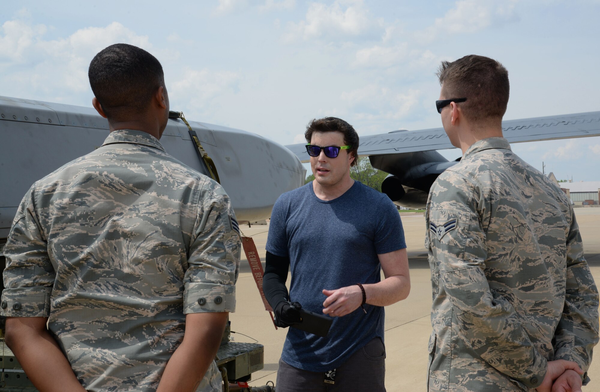 Jared Estes, a motivational speaker and survivor of burn injuries caused by a drunk driver, speaks to Senior Airman Gregory Scott, 2nd Munitions Squadron, left, and Airman 1st Class Gregory Adams, 2nd MUNS, at Barksdale Air Force Base, La., April 14, 2016. Throughout the day, Estes told his story of resilience to Barksdale’s Airmen and families and spoke of how he overcame severe burns on nearly 50 percent of his body, the loss of his wife, Paige Estes, in the drunken driving incident that injured him. (U.S. Air Force photo/Staff Sgt. Benjamin Raughton)