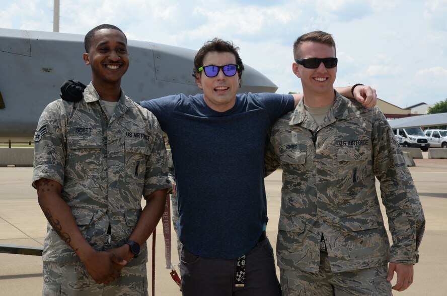 Jared Estes, a motivational speaker and survivor of burn injuries caused by a drunk driver, poses for a photo with Senior Airman Gregory Scott, 2nd Munitions Squadron, left, and Airman 1st Class Gregory Adams, 2nd MUNS, at Barksdale Air Force Base, La., April 14, 2016. After telling his resilience story of overcoming the fiery and painful aftermath of a drunken driving incident where his vehicle was hit by a driver who was moving at more than 100 miles per hour, he toured the B-52 Stratofortress and learned from Scott and Adams about its weapons systems. (U.S. Air Force photo/Staff Sgt. Benjamin Raughton)